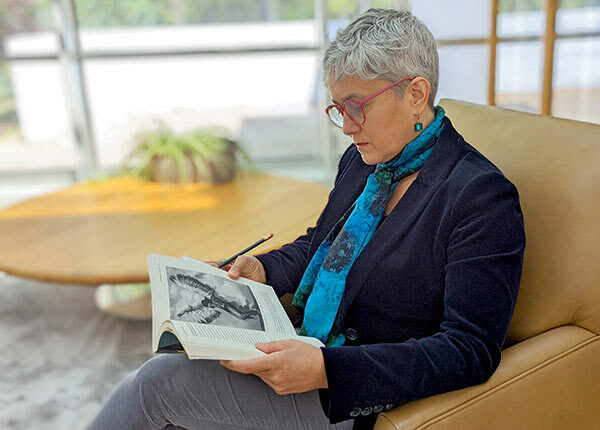 NHC Fellow reading in the Commons