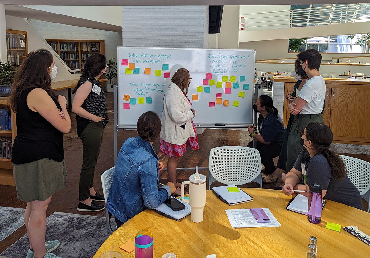 grad students working at a whiteboard