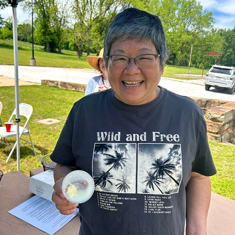 One excited participant showcases her freshly-churned butter for the camera. Photo courtesy of Historic Cane Hill.