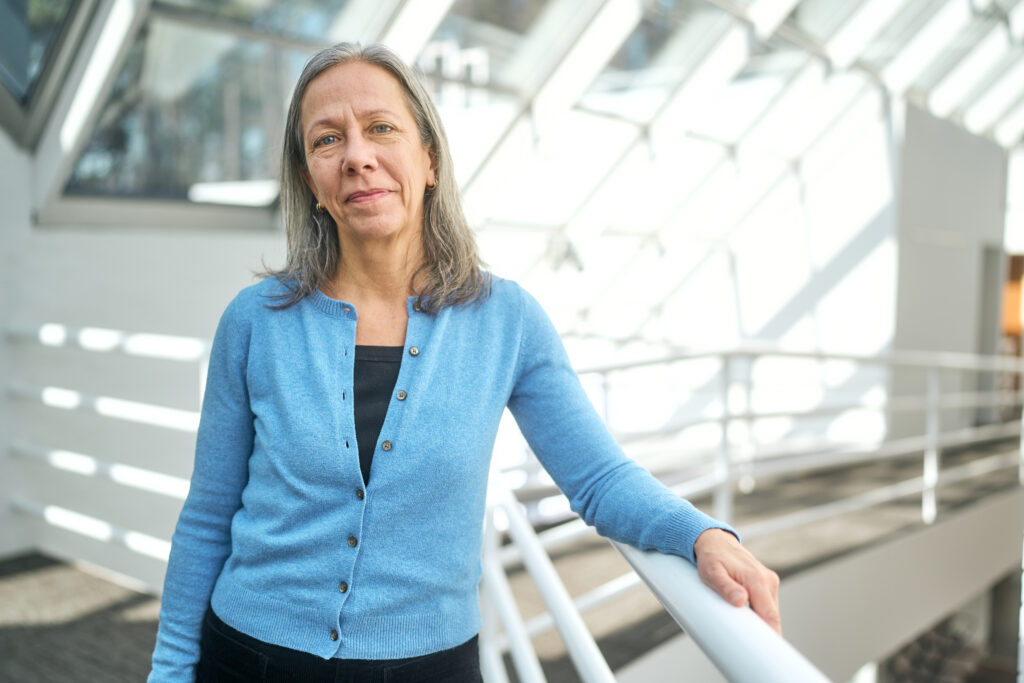 Kathleen DuVal (NHC Fellow, 2008–09; 2025–26) faces the camera on the NHC interior mezzanine