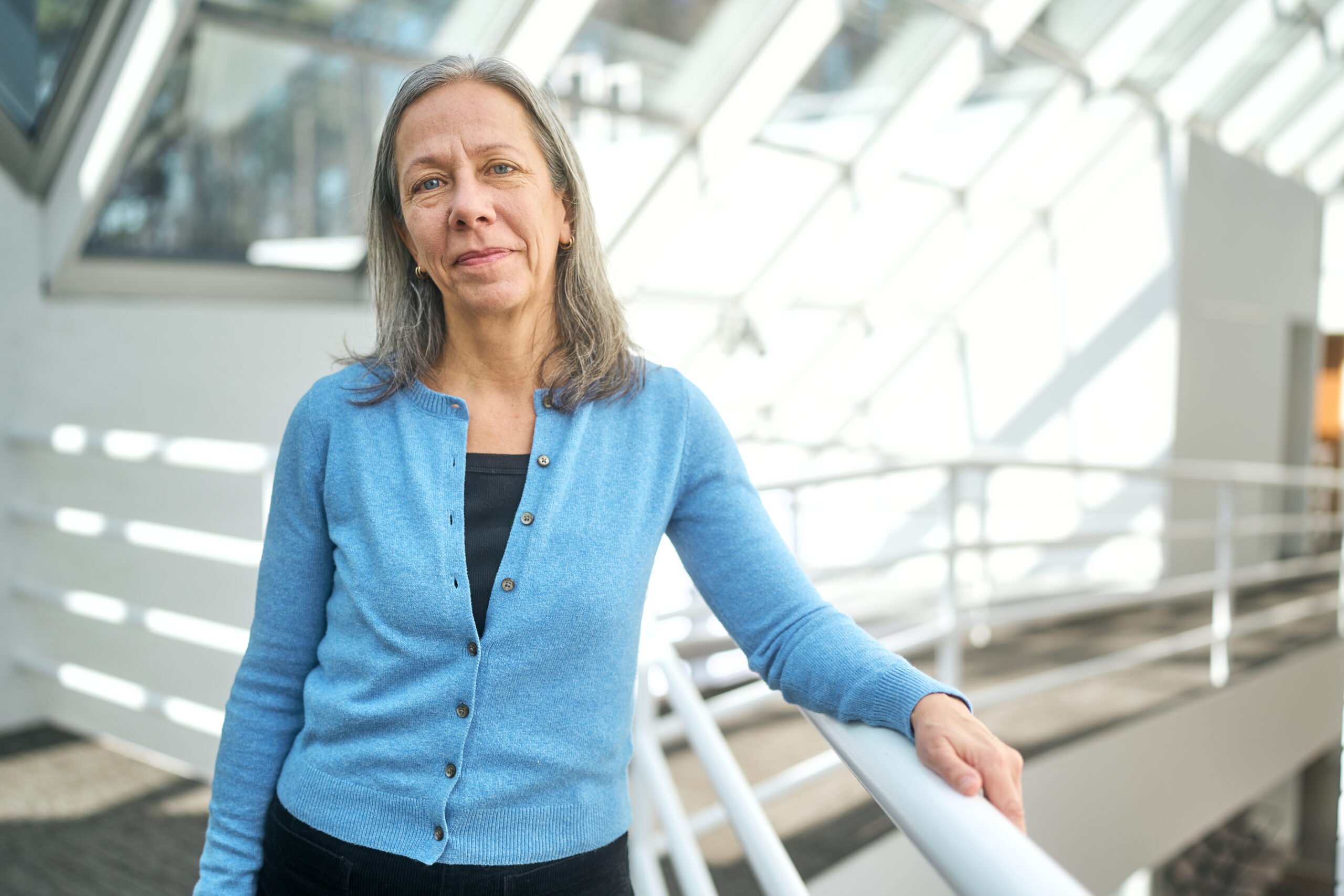 Kathleen DuVal (NHC Fellow, 2008–09; 2025–26) faces the camera on the NHC interior mezzanine